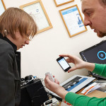  Liza with her audiologist, Dr. Anton Parshin, during her fitting for the Oticon Medical Ponto Plus System