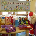 Santa Clause (played by Zach Gulley) hands out presents on December 20th, 2014 at the Toy Drive for Microtia and Atresia kids of Colorado through the Ear Community Organization.