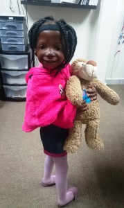 October 6, 2015, Lebo Pretty Ndladla wearing her new Otiocn Medical Ponto Plus hearing devices with her new Oticon Medical monkey, Massie