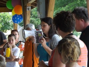 Melissa Tumblin, Founder of Ear Community speaking with families at an Ear Community picnic in Ohio.