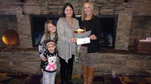 December, 18th 2015.  Julia Patrick of Resort2Kindness presenting Melissa Tumblin a grant check for $10,000 for the Ear Community Organization.  Pictured with her two children, Hailey and Ally (whom Ear Community was founded after).