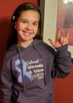 Ally Tumblin wearing her National Microtia and Atresia Awareness Day shirt on November 9th.