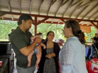 Getting genetics information at the Boston Ear Community picnic with Barbara McDonough from Harvard