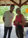 Dr. Tahiri and an early intervention teacher at the Ear Community picnic