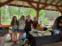 Cochlear Americas at the Boston Ear Community picnic with service dog