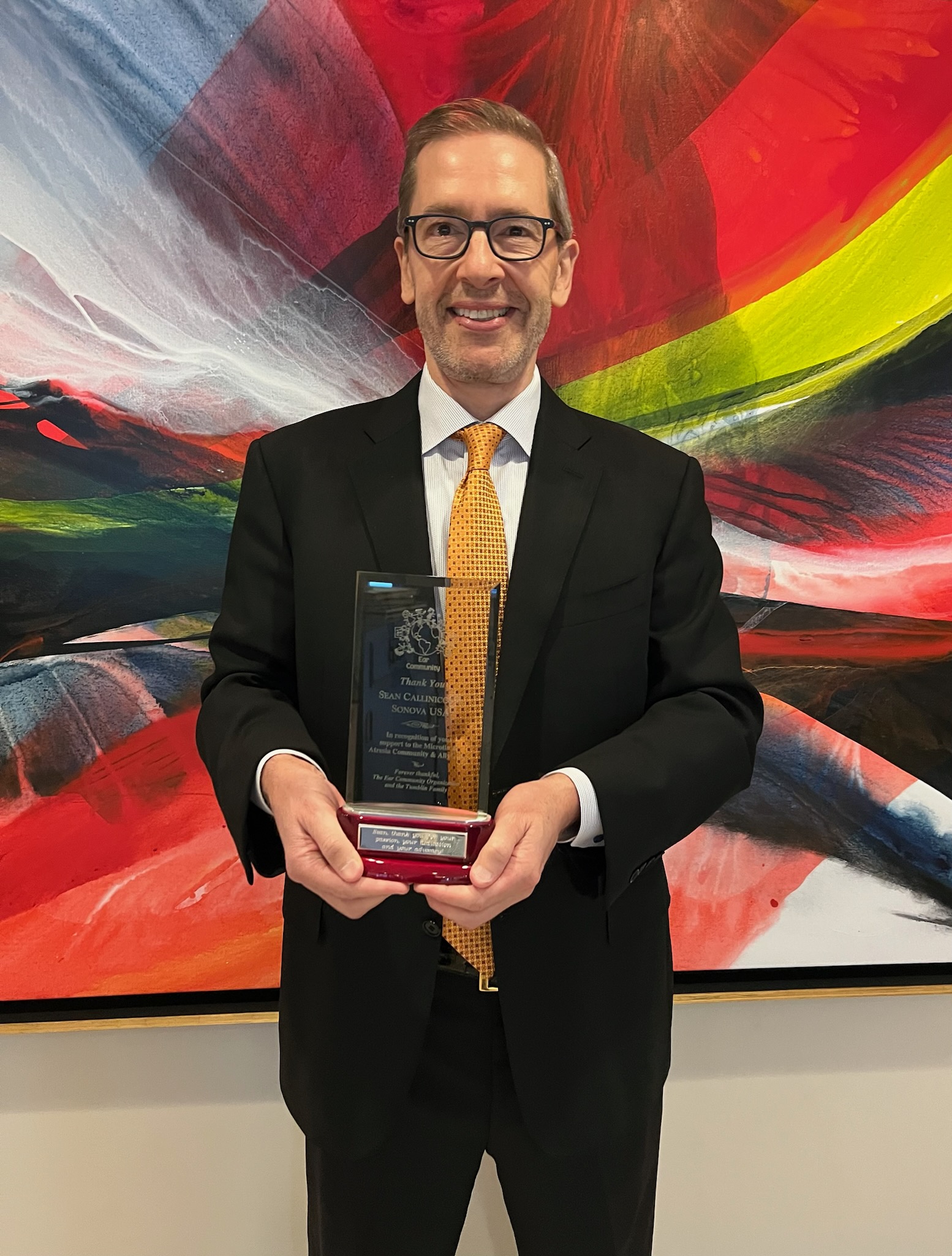 Sean Callinicos receives advocacy award from the Ear Community Organization