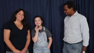 Melissa and Ally Tumblin with Congressman Neguse championing Ally's Act, a bipartisan Federal piece of legislation that would cover BAHS and CI hearing device systems.